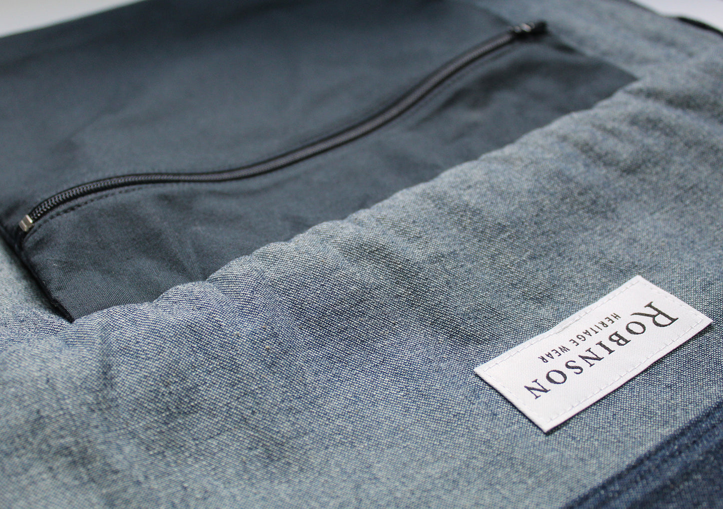 Close up of zip pocket and Robinson Heritage label.
