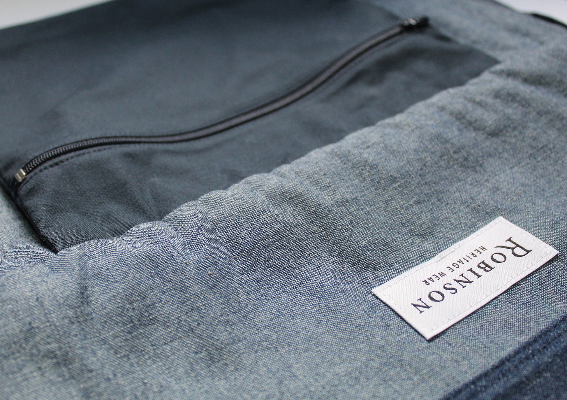 Close up of zip pocket and Robinson Heritage label.